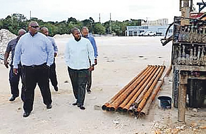 Adrian Gibson, Water and Sewerage Corporation executive chairman, is pictured (right, front row) inspecting the site for a new reverse osmosis plant in North Eleuthera. Also shown (front, left) is Gaddy Senatus, service manager, Suez Aqua Design Bahamas Ltd; back row from left, Thomas Desmangles, distribution operations manager; Cyprian Gibson, assistant general manager and Elwood Donaldson, general manager.

Photo: Patrick Hanna/BIS