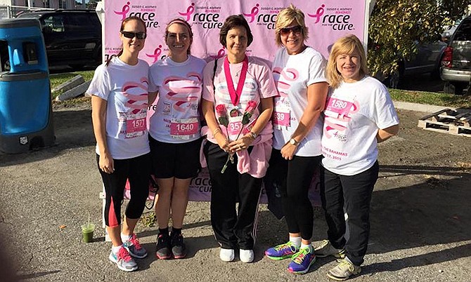 Helen Pinder (centre; holding the flowers) takes part in the 2015 Susan G Komen Race for the Cure.
