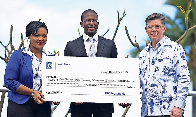 Robert Turnquest, Chairman for the Over-the-Hill Community Development Foundation, along with Rob Johnston of the Royal Bank of Canada. Photo: Terrel W. Carey Sr/Tribune staff