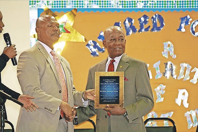Alfred Forbes was honoured on Wednesday by the CI Gibson Secondary School’s Principal, faculty, students and friends.

Photo: Koy T Martin/Tribune Staff