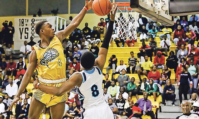 Janus Shepherd, of the Doris Johnson Mystic Marlins, tries to block a shot by an Anatol Rodgers Timberwolves player in game one of the series.