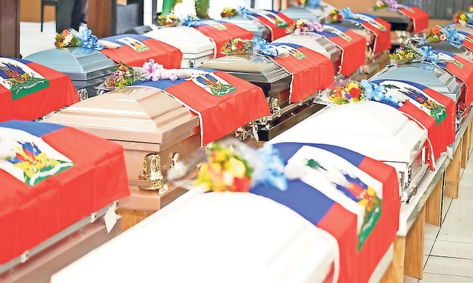 Coffins lined up in the Enoch Beckford Auditorium.