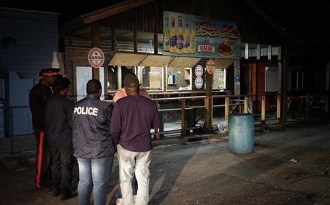 Police at the scene of the Potter’s Cay Dock shooting on Sunday night. Photo: Terrel W Carey Sr/Tribune staff