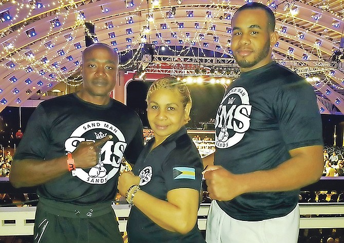 PRO heavyweight boxer Amron Sands (far right) with his mother Marie Smith and Bahamian coach Ronn Rodgers after his first round victory on Saturday in St Petersburg, Florida.