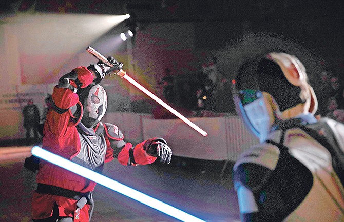 Julien Esprit, left, competes with Jean Baptiste Marchetti-Waternaux during a national lightsaber tournament in Beaumont-sur-Oise, north of Paris. In France, it is easier than ever now to act out “Star Wars” fantasies. The fencing federation has officially recognised lightsaber dueling as a competitive sport. Photo: Christophe Ena/AP