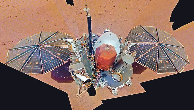 This image from December made available by NASA shows the InSight lander. The scene was assembled from 11 photos taken using its robotic arm. The two white stalks between the centre and the solar panels are weather sensors. Starting this week, NASA’s Jet Propulsion Laboratory is posting the high and low temperatures online, along with wind speed and atmospheric pressure from the InSight lander. Photo: NASA/AP