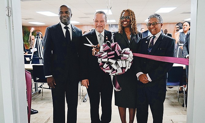 The official ribbon cutting ceremony. From left: Ellsworth Johnson, Minister of State for Legal Affairs, Attorney General Carl Bethel, Tonya Bastian Galanis, Principal EDLS, and Reginald T. A. Armour. 
Photo: Terrel W Carey Sr/Tribune Staff