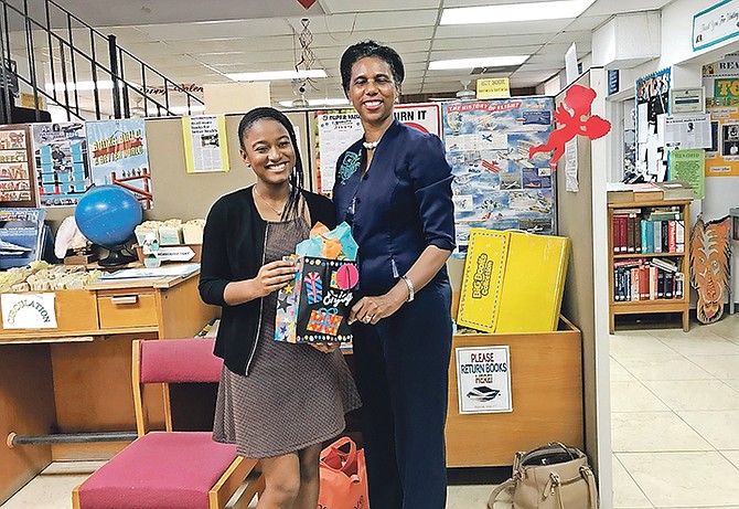 Teen author Sierra Blair (left) with Dorcas Bowler, the Ministry of Education’s Director of Libraries for the National Library and Information Services Department.