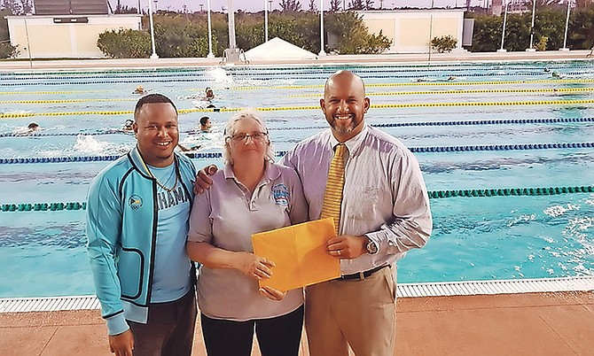 Seawaves' founder Shirley Mireault is greeted by BOC secretary general Derron Donaldson and BTA president Dorian Roach.