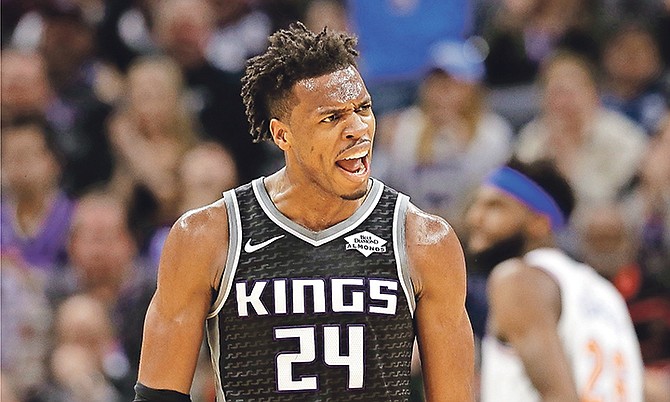 Sacramento Kings guard Buddy Hield celebrates after his team scored against the New York Knicks during the first quarter of an NBA basketball game Monday, in Sacramento, Calif. (AP Photo/Rich Pedroncelli)