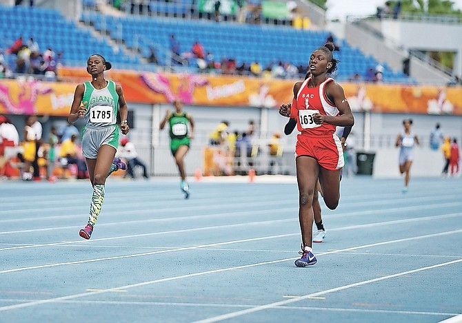 FAST TRACK: Students compete yesterday on day one of the Bahamas Association of Independent Secondary Schools’ Track and Field Championships at the new Thomas A Robinson National Stadium. 
Photo: Terrel W Carey/Tribune Staff