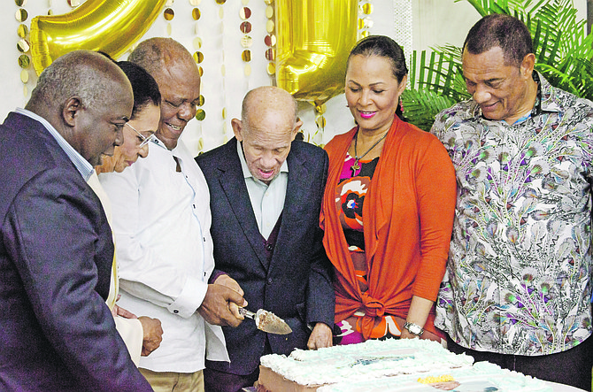 From left: Opposition leader Philip Davis, Governor General Dame Margueritte Pindling, former Prime Minister Hubert Ingraham, former Governor General Arthur Dion Hanna, Bernadette Christie, former Prime Minister Perry Christie. Below: Mr Hanna with his daughter Englerston MP Glenys Hanna-Martin and extended family. Photo: Daniel Hanna