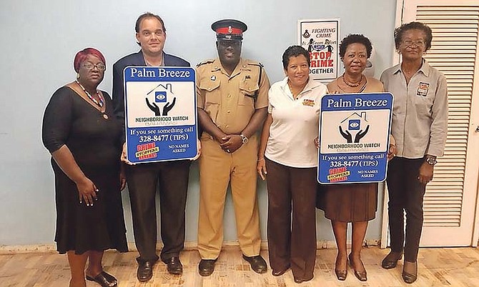 Crime Stoppers Bahamas is partnering with the Neighbourhood Crime Watch groups. Pictured here are, from the left, VP Bowe of Palm Breeze,  President of Palm Breeze Craig Lowe, Insp Kendrick Brown SW Coordinator for Neighbourhood Watch Group, Marisa Ahwai Chairman of Crime Stoppers Bahamas, Zone Captain  Strachan of Palm Breeze, Frances McKenzie-Oliver Director of Crime Stoppers Bahamas.
