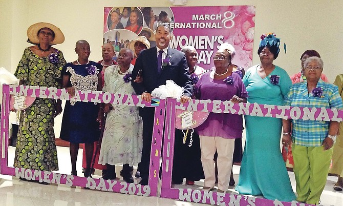 Minister Frankie Campbell poses with honourees and guests for International Women’s Day.