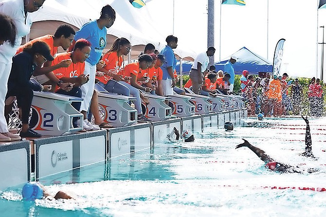 Time keepers keeping track of the performances of the swimmers.