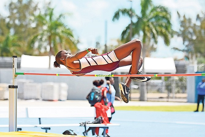 Kenya Forbes competes in the high jump. Photos: Shawn Hanna/Tribune staff