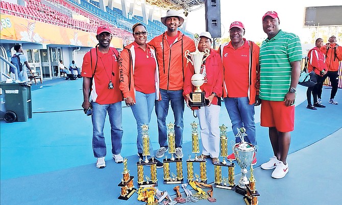 WINNING WAYS: St Augustine’s College coaches Tito Moss, Dawn Johnson and Jason Edwards show off their awards with principal Sonia Knowles and coach William ‘Knucklehead’ Johnson.