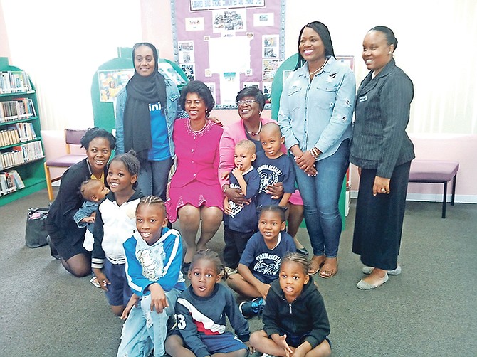 Dorcas Bowler with children participating in reading and reflection for National Library Month.