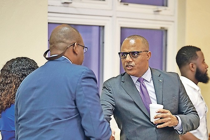 Minister of National Security Marvin Dames shakes hands with Alfred Lewers Jr of ShotSpotter on Thursday.

Photo: Terrel W Carey Sr/Tribune Staff