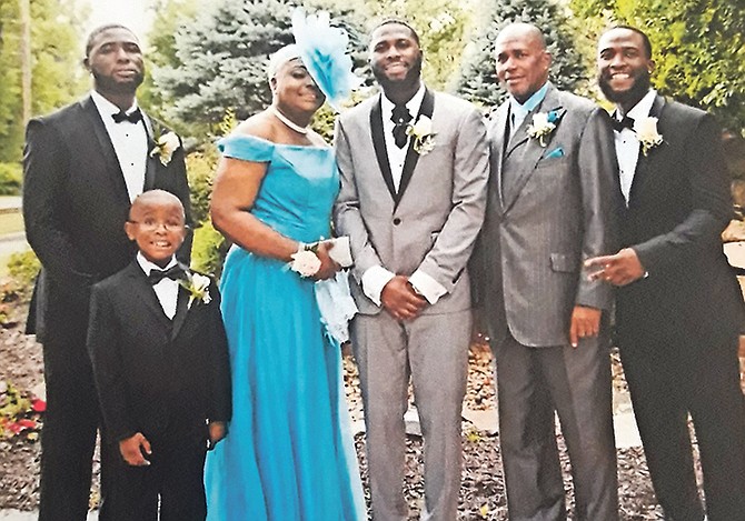 Rev George Bodie (second from right) with his wife Lolita Michelle, sons George III, Joshua and Aaron, and grandson.