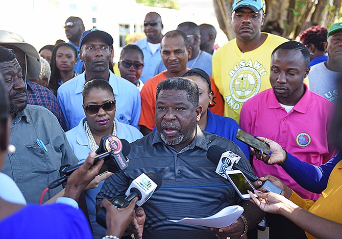 Water and Sewerage Corporation employees hold a demonstration outside WSC Headquarters. President of the Bahamas Water and Sewerage Union Dywane Woods is pictured speaking to media. Photo: Shawn Hanna/Tribune Staff