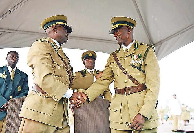 Charles Murphy, right, takes over as the new commissioner of the Bahamas Department of Correctional Services. He is seen shaking hands with the former commissioner Patrick Wright.

Photos: Shawn Hanna/Tribune Staff