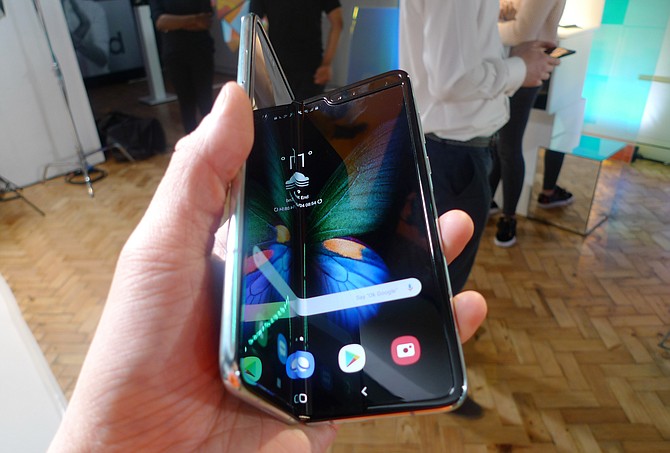 The Samsung Galaxy Fold smartphone is seen during a media preview event in London, this week. Samsung is hoping the innovation of smartphones with folding screens reinvigorates the market. Photo: Kelvin Chan/AP