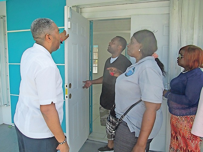 Minister of Social Services and Urban Development Frankie Campbell (left) inspects the building that will house the island’s tenth Urban Renewal Centre, at Flamingo Gardens Park. Also pictured (from left) are Corporal Gerard Butterfield; Pam Miller, operations manager, Urban Renewal Commission, and Sheryl Knowles, programmes and special projects coordinator, Urban Renewal Commission. Photo: Matt Maura/BIS