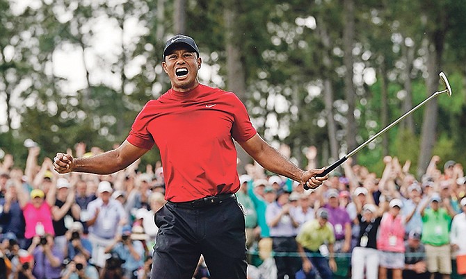 Tiger Woods reacts as he wins the Masters golf tournament on Sunday in Augusta, Georgia.

Photo: David J Phillip/AP
