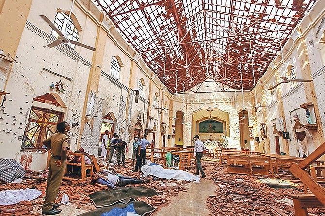 Bodies of victims lie inside St Sebastian’s Church damaged in blast in Negombo, north of Colombo, Sri Lanka on Sunday.