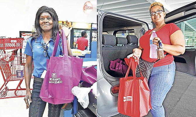 Customers received free bags at one of three major grocery stores when out shopping yesterday. Photos: Terrel W Carey/Tribune staff