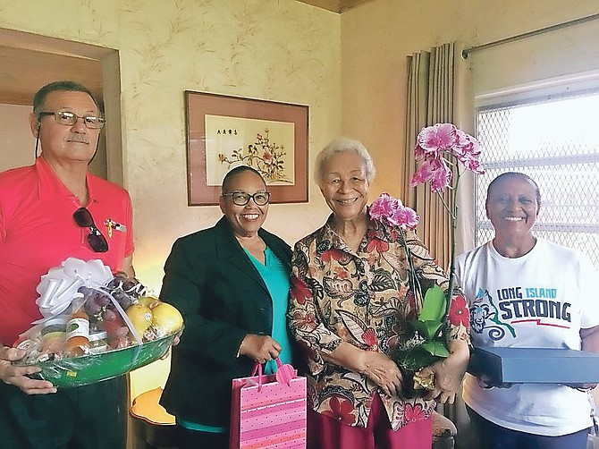 The Long Islanders’ Association members visited Dame Ivy Dumont on Monday to present her with a plaque for Nation Building, a ‘Long Island Strong’ Long Island week T-shirt, a fruit basket and an assortment of jams and jellies from Long Island; presented by Henderson Burrows, Dr Ruth Sumner, Cheryl Deal and president Gina Coakley.