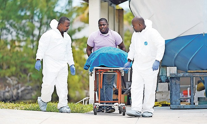 The body was taken out of the canal in eastern New Providence yesterday.
Photo: Terrel W Carey Sr/Tribune Staff