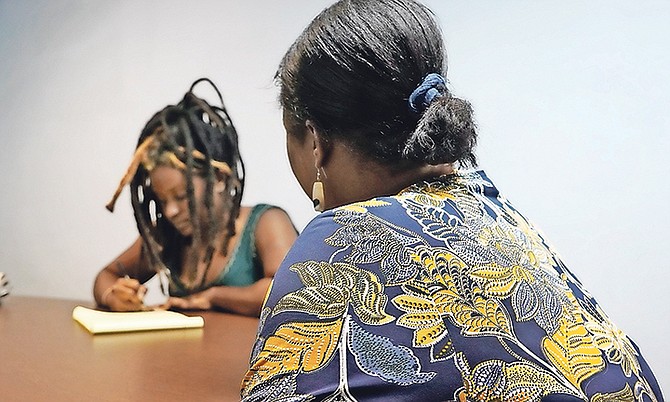 Claudia Bethel, right, talks to Tribune chief reporter Ava Turnquest. Photo: Terrel W Carey Sr/Tribune staff