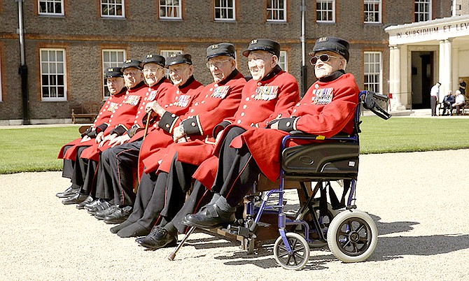 British Chelsea Pensioners who are veterans of the World War II Battle of Normandy, codenamed Operation Overlord, and D-Day pose for a group photograph during a D-Day 75th anniversary photocall at the Royal Hospital Chelsea in London yesterday.