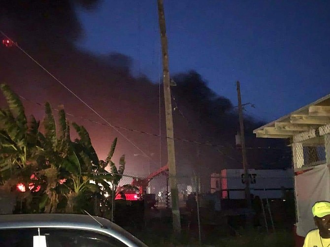 Smoke clouds rising from the Bimini power facility