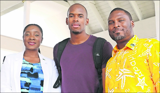 STEVEN GARDINER (centre) with Minister of Youth, Sports and Culture Lanisha Rolle and Drumeco Archer, president of the BAAA.