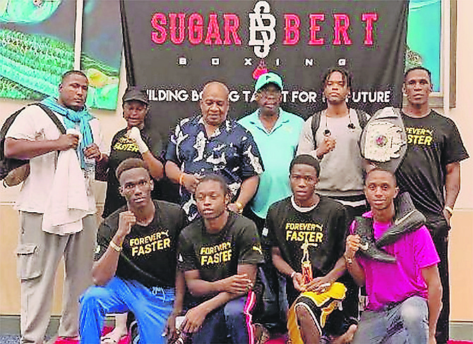 TEAM BAHAMAS at the Sugar Bert Boxing Tournament. Kneeling (l-r) are Lennox Boyce, Ronald Woodside, Patrick Joseph and Jovan Johnson. Standing are Keishno Major, Elizabeth Hutchinson, Wellington Smith, Vincent Strachan, Keith Major Jr and Carl Hield.