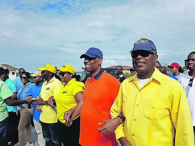 Frederick McAlpine marching arm in arm with PLPs during the Labour Day Parade.