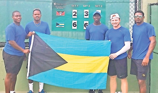 Bahamas Davis Cup team of Philip Major Jr, captain Marvin Rolle, Donte Armbrister, Baker Newman and Justin Lunn pose above after their victory over Antigua & Barbuda.