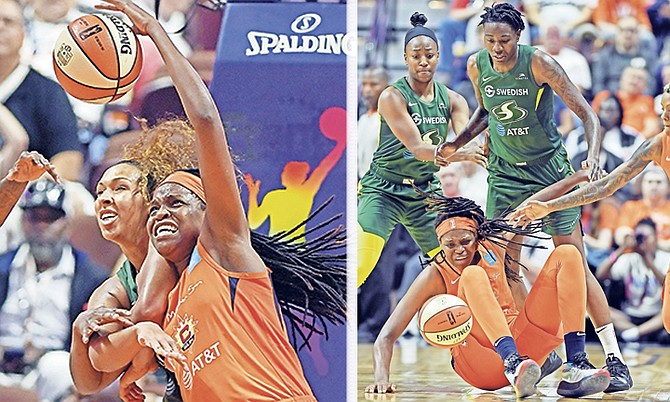 LEFT: Connecticut Sun centre Jonquel Jones is fouled fighting for a rebound with Seattle Storm centre Mercedes Russell, back, on Sunday at Mohegan Sun Arena.

RIGHT: Sun guard Courtney Williams, right, races to the ball as centre Jonquel Jones falls to the floor while being defended by Seattle Storm forward Natasha Howard, centre, and Jewell Loyd, left.

Photos: Sean D Elliot/The Day via AP