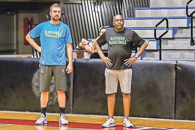 Coach Chris DeMarco stands next to Mario Bowleg.
Photos by John Marc Nutt