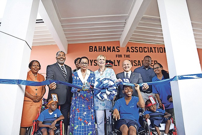 The Ministry of Social Services and Urban Development in conjunction with The Bahamas Association for The Physically Disabled held the dedication and ribbon cutting of their newly covered driveway and verandah. Pictured from (L-R) during the ribbon cutting are: Sherrylee Smith, Social Services and Urban Development Permanent Secretary; Frankie Campbell, Minister of Social Services and Urban Development; Dame Marguerite Pindling, Governor General; Charlotte Albury, B.A.P.D President and Michael Foulkes, Parliamentary Secretary in the Ministry of Social Services and Urban Development. Photo: Shawn Hanna/Tribune Staff