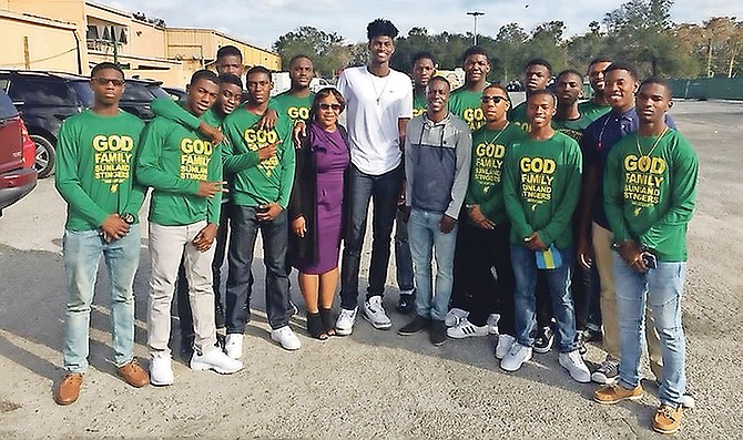 Jonathan Isaac, centre, shares a special moment with his fans. The Orlando Magic star is expected to make an appearance at the fourth annual Stingers Elite Basketball Camp today.
