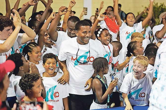 Mako Aquatics Club members celebrate at the Betty Kelly Kenning swimming complex after winning the National Swimming Championships. Photo: Terrel W Carey Sr/Tribune staff