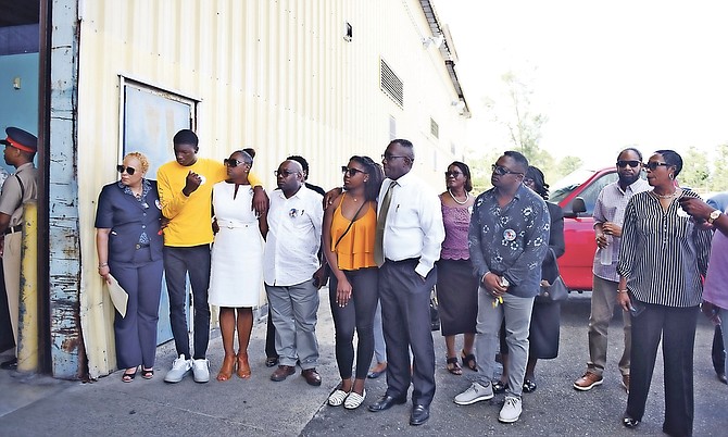 The families of Bahamians Blair John and Alrae Ramsey gathered yesterday at LPIA. Photo: Shawn Hanna/Tribune Staff