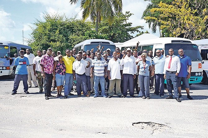 Bus drivers from different routes park in the old City Market parking lot off Market Street. Photo: Terrel W. Carey Sr/Tribune Staff