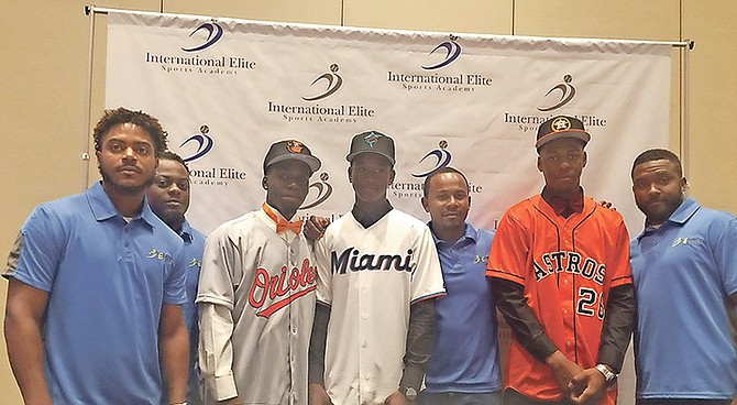 Shown (l-r) are Dax Stubbs (Baltimore Orioles), Ian Lewis (Miami Marlins) and Everett Cooper (Houston Astros) with members of the I-Elite Coaching staff on International Signing Day.