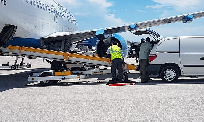 The bodies of the crash victims were transferred onto a Bahamasair plane in Grand Bahama on Friday.