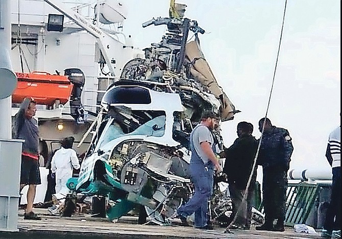 The helicopter after it was brought to the surface. (©The Tribune)